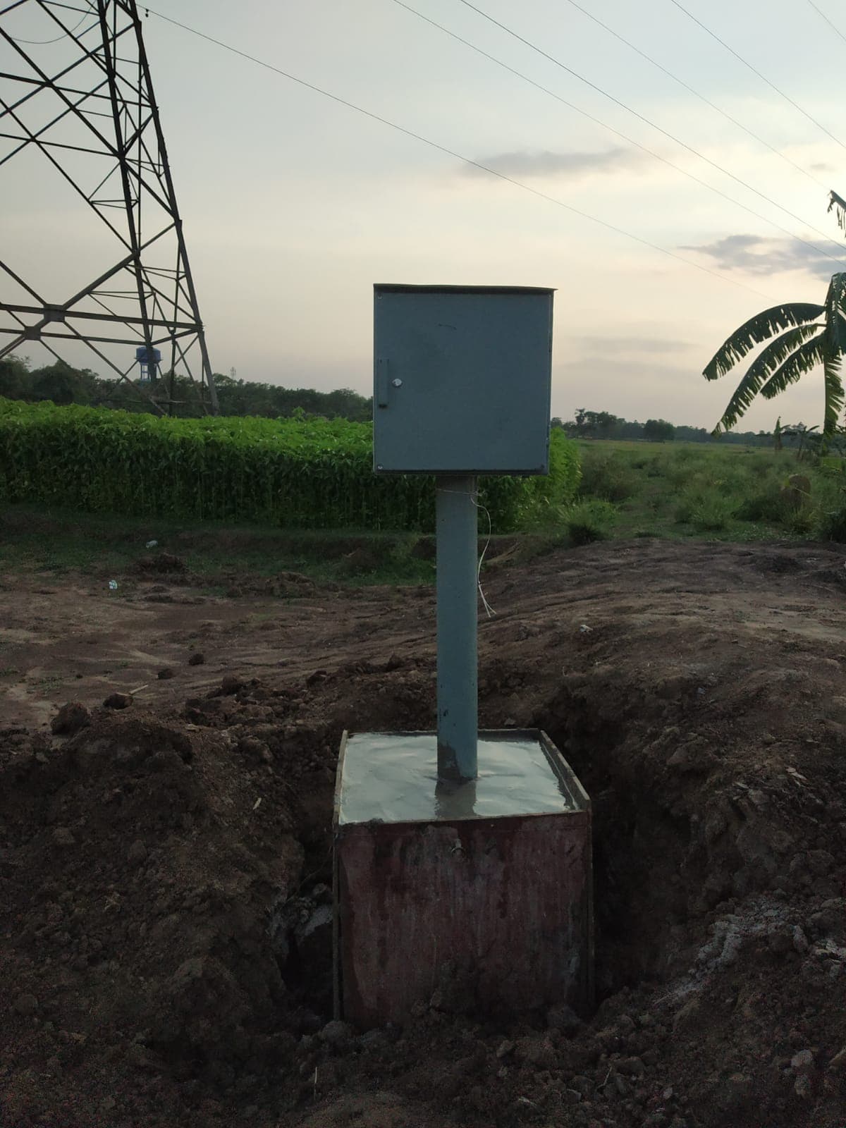 H type test lead point installed on a cast concrete foundation at a pipeline right of way
